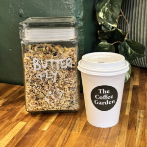 Butterfly premium loose-leaf herbal tea with The Coffee Garden cup in Uptown Houston.