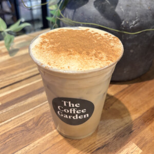 Pumpkin Cream Chai with pumpkin cold foam and cinnamon at The Coffee Garden in Uptown Houston.