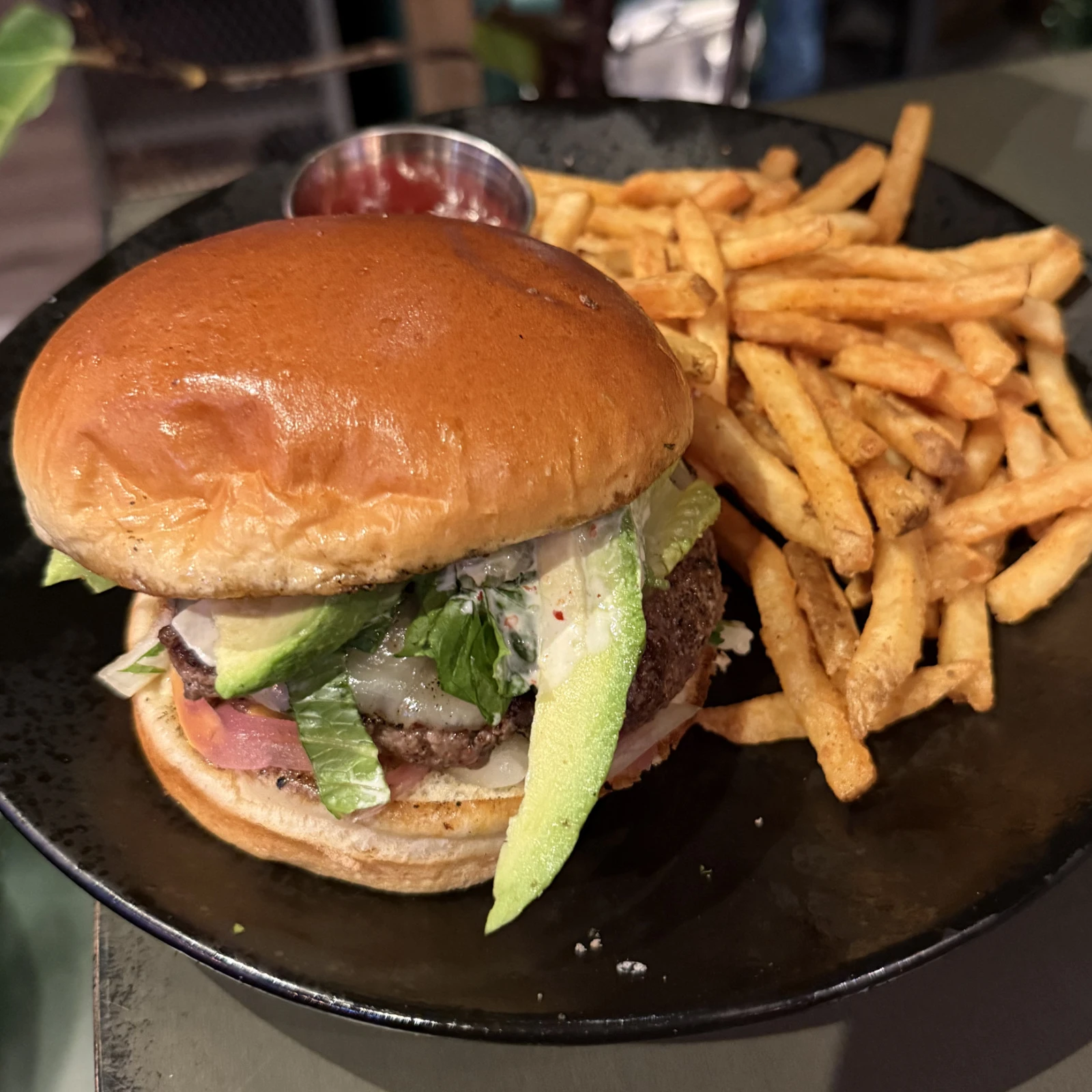 Botanic Burger with bacon, provolone, avocado, jalapeño mayo, and fries at The Coffee Garden in the Heights, Houston TX 77007.