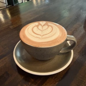 Beetroot Cacao Latte with latte art served at The Coffee Garden in the Heights, Houston TX 77007.